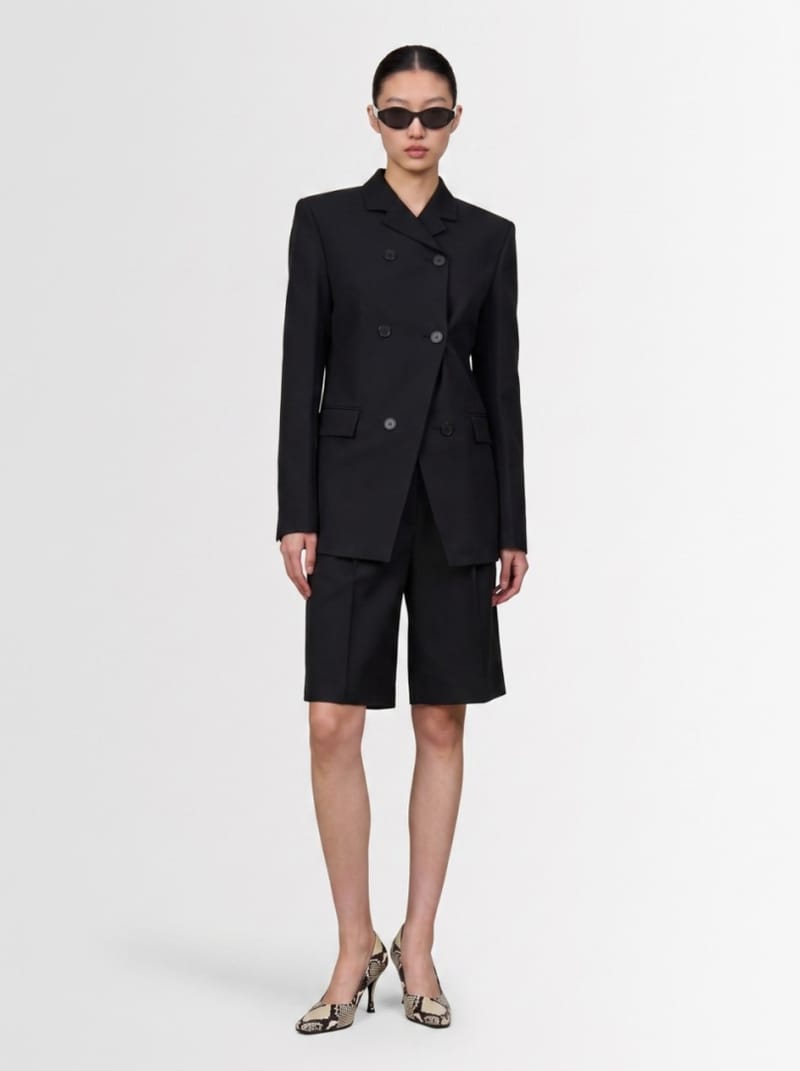 Khaite - Virgin wool pleated bermuda shorts
